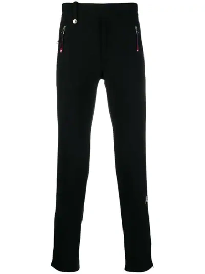 Shop Alexander Mcqueen Logo Embroidered Track Pants In Black