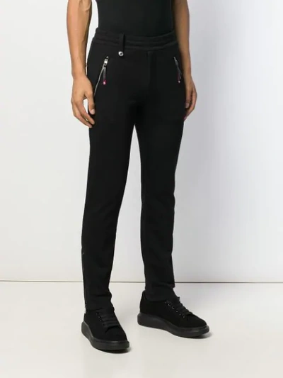 Shop Alexander Mcqueen Logo Embroidered Track Pants In Black