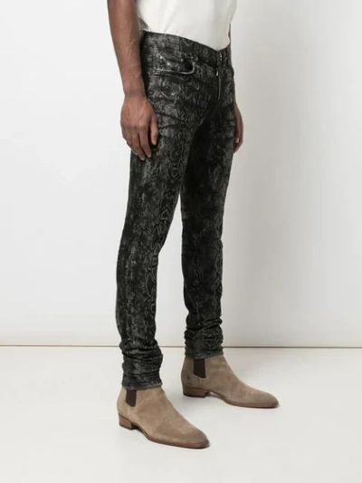 Shop Amiri Laser Snake Stack Skinny Jeans In Grey