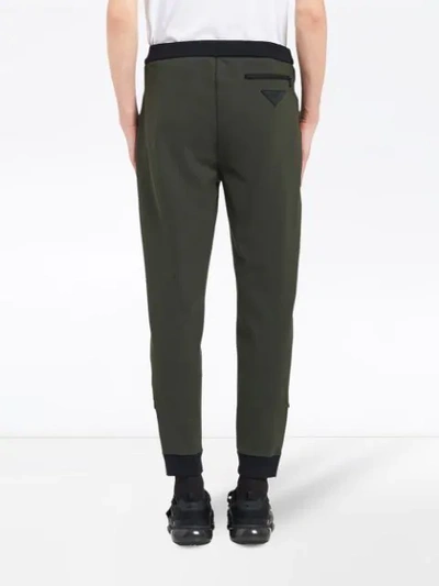 Shop Prada Punto Stoffa Track Trousers In F0n06 Dark Green+black