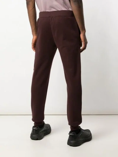 C.p. Company Round Logo Track Pants In Brown