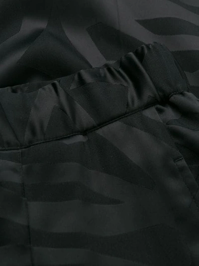 Shop Neil Barrett Slim-fit Print Trousers In Black