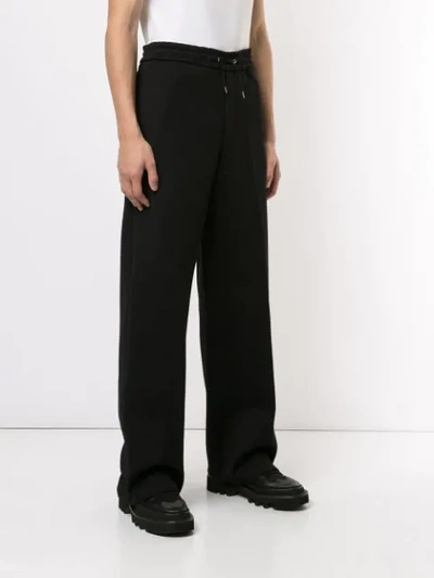 Shop Oamc Drawstring Wide Trousers In Black