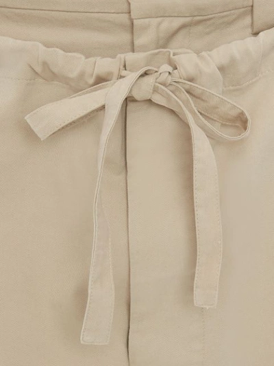 Shop Jw Anderson Drawstring Double Front Trousers In Neutrals