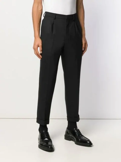 Shop Ami Alexandre Mattiussi Pleated Carrot Fit Trousers In Black