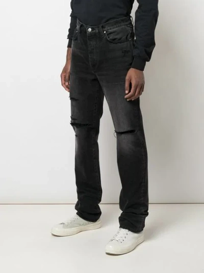 Shop Amiri Thrasher Loose Jeans In Black