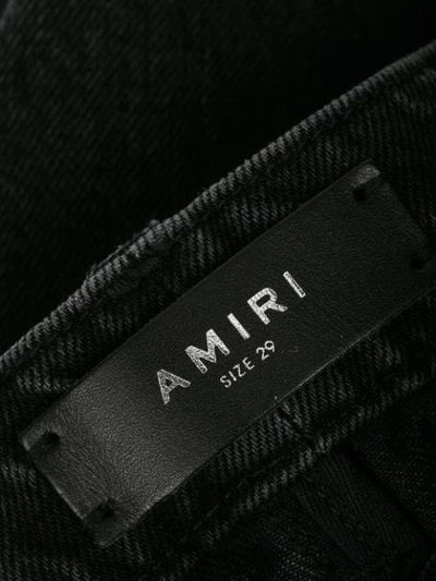 Shop Amiri Thrasher Loose Jeans In Black