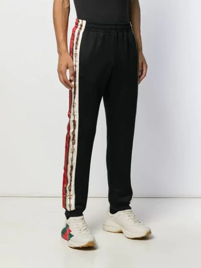 Shop Gucci Logo Stripe Track Pants In Black