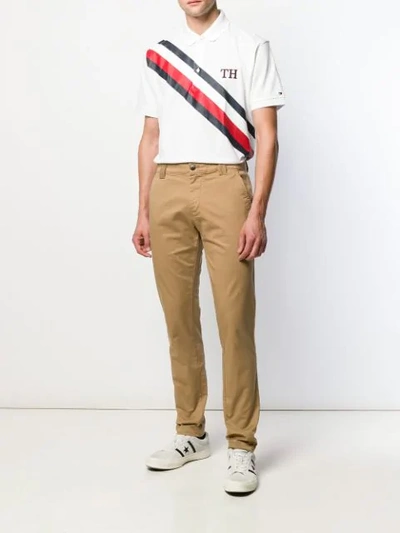 Shop Tommy Hilfiger Th Stripe Polo Shirt In White