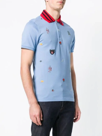 Shop Gucci Patched Motifs Polo Shirt In Blue