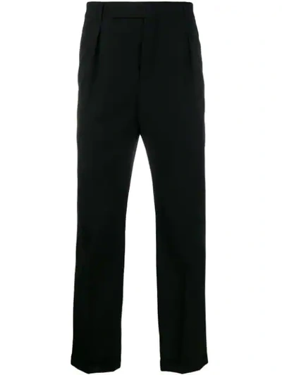 Shop Saint Laurent Cuffed Tailored Trousers In Black