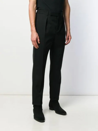 Shop Saint Laurent Cuffed Tailored Trousers In Black