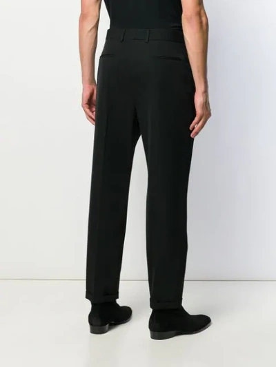 Shop Saint Laurent Cuffed Tailored Trousers In Black