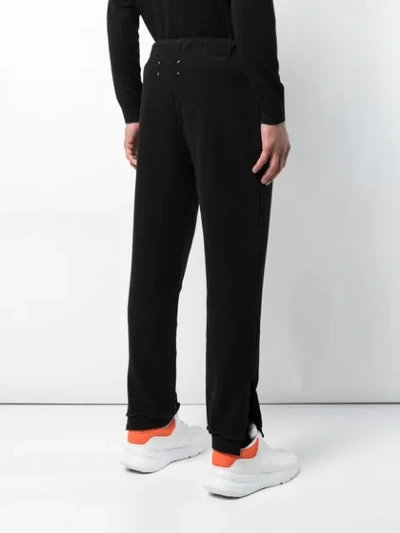Shop Maison Margiela Loose Fitted Track Trousers In Black