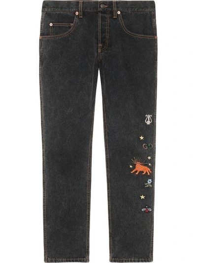 Shop Gucci Embroidered Motif Slim-fit Jeans In Black