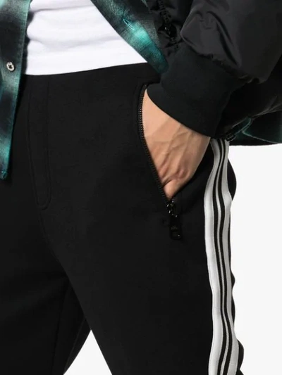 Shop Neil Barrett Side Stripe Track Trousers In Black