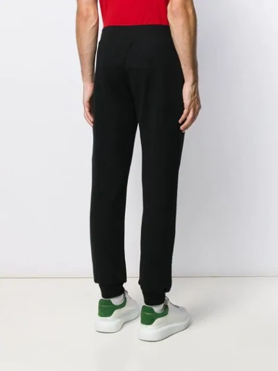 Shop Moschino Double Question Mark Track Pants In Black