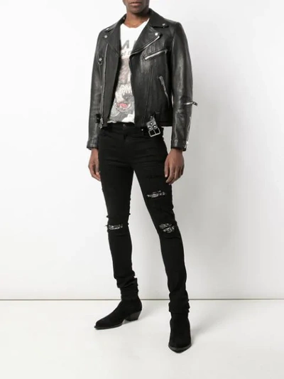 Shop Amiri Crystal Patch Distressed Skinny Jeans In Black