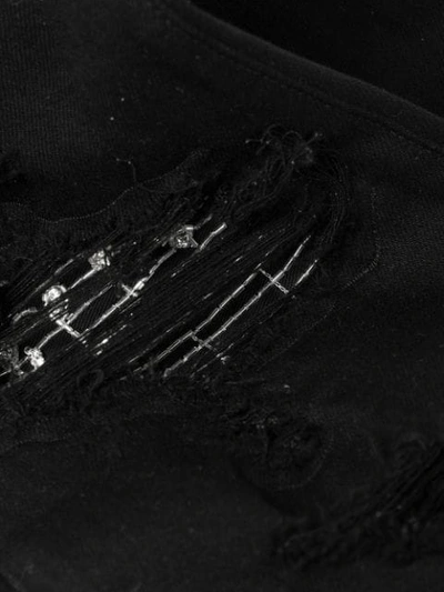 Shop Amiri Crystal Patch Distressed Skinny Jeans In Black