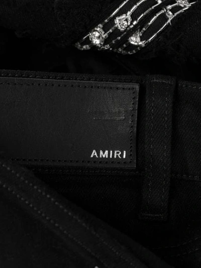 Shop Amiri Crystal Patch Distressed Skinny Jeans In Black