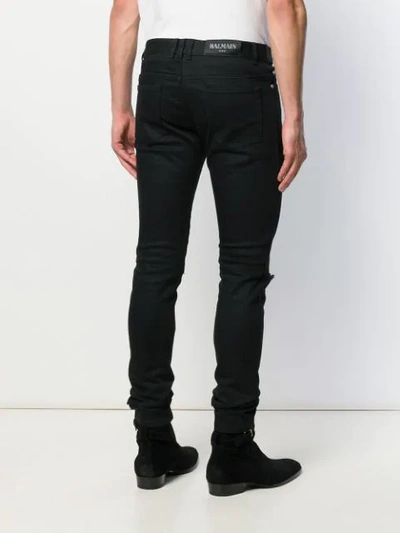 Shop Balmain Ripped Skinny Jeans In Black