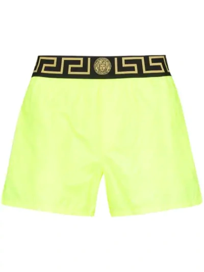 Shop Versace Logo-waist Swim Shorts In Yellow