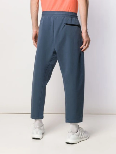 Shop Nike Cropped Track Pants In Blue