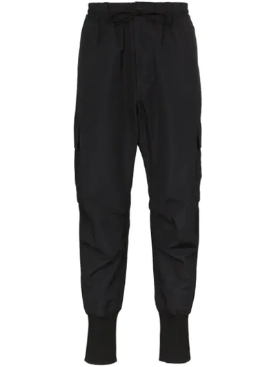 Shop Y-3 Cargo-style Tapered Trousers In Black