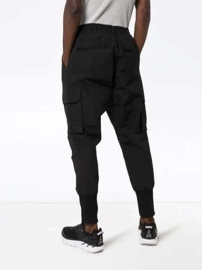 Shop Y-3 Cargo-style Tapered Trousers In Black