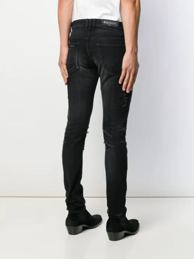 Shop Balmain Distressed Slim-fit Jeans In Black