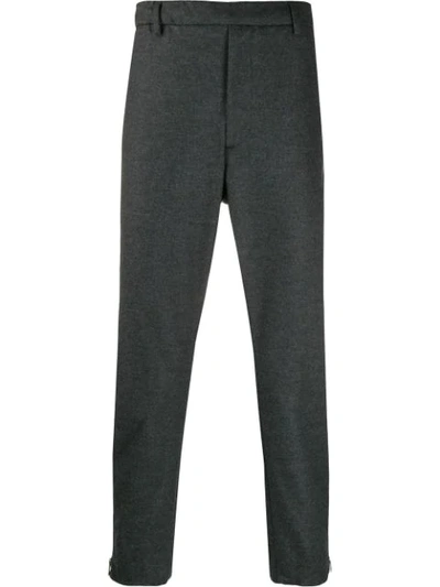 Shop Prada Zipped Cuffs Trousers In Grey