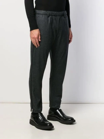 Shop Prada Zipped Cuffs Trousers In Grey