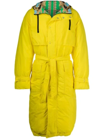 Shop Versace Hooded Belted Raincoat In Yellow