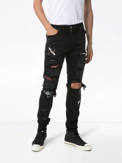 AMIRI DISTRESSED PATCH-EMBROIDERED JEANS - 黑色