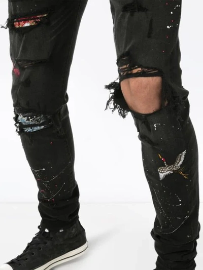 AMIRI DISTRESSED PATCH-EMBROIDERED JEANS - 黑色