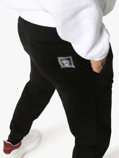 Shop Versace Medusa Motif Patch Track Pants In Black