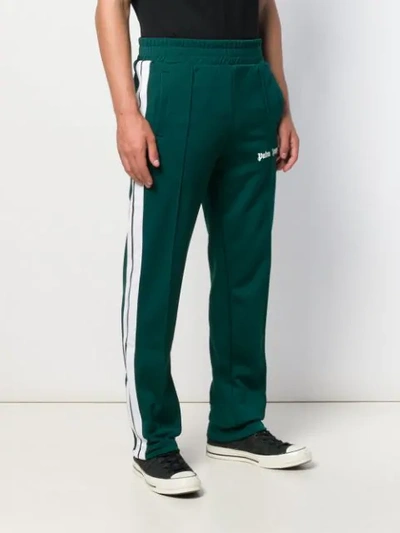 Shop Palm Angels Panelled Track Logo Trousers In Green