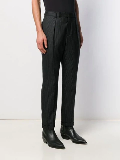 Shop Saint Laurent Pinstriped Cropped Trousers In Black