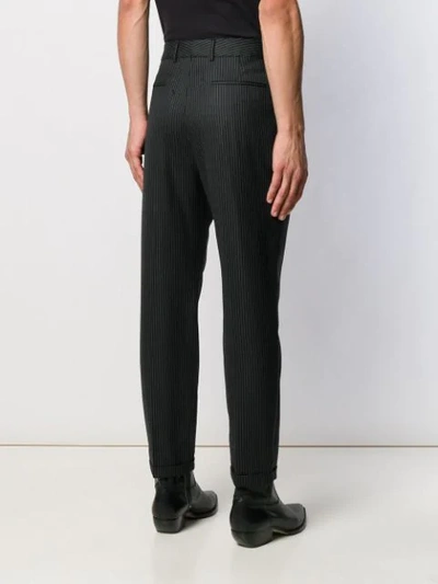 Shop Saint Laurent Pinstriped Cropped Trousers In Black
