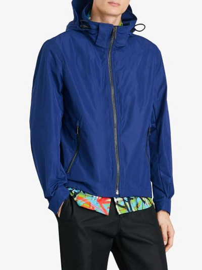 Shop Burberry Packaway Hood Rain Jacket - Blue
