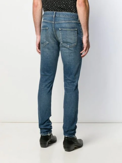 Shop Saint Laurent Faded Slim Jeans In Blue