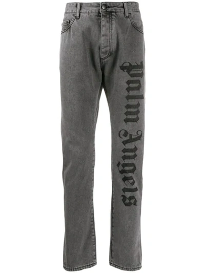 Shop Palm Angels Logo Print Jeans In Grey
