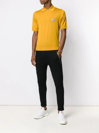 Shop Prada Logo Knitted Polo Shirt In Yellow