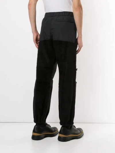 Shop Undercover Shearling Detail Trousers In Black