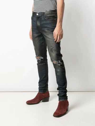 Shop Amiri Thrasher Minimal Jeans In Black