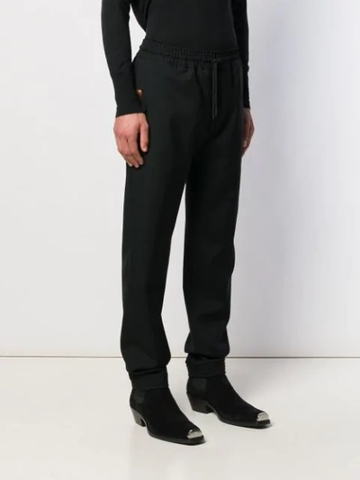 Shop Givenchy Drawstring Trousers In Black