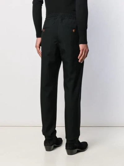 Shop Givenchy Drawstring Trousers In Black