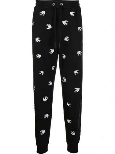 Shop Mcq By Alexander Mcqueen All-over Swallow-print Joggers In Black