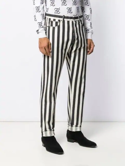 Shop Saint Laurent Striped Straight Jeans In White