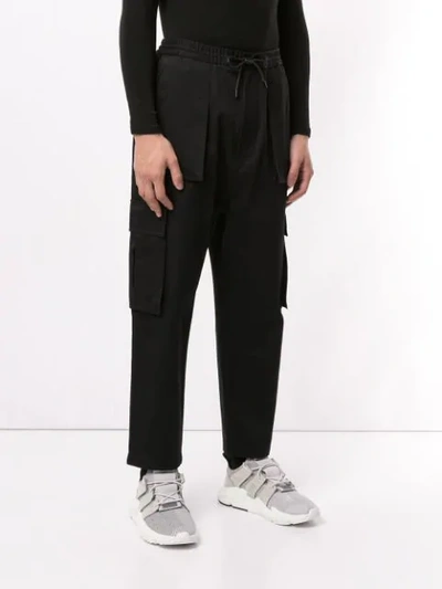 Shop Juunj Utility Trousers In Black